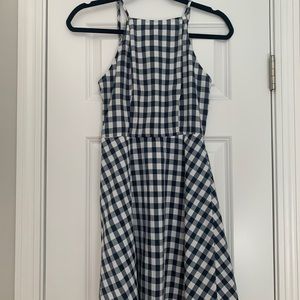 Navy checkered deep v open back dress.